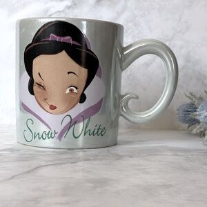 DISNEY Snow White “Brains, Beauty, Charm!” Ceramic Mug of Snow White Winking.